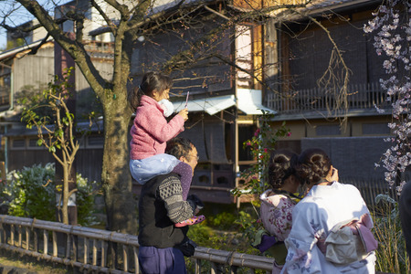 Kyoto,Japan - 27 March,2015 : Father and kid and japanese kimono women and cherry blossomのeditorial素材
