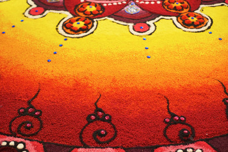 Deepak with colourful rangoli