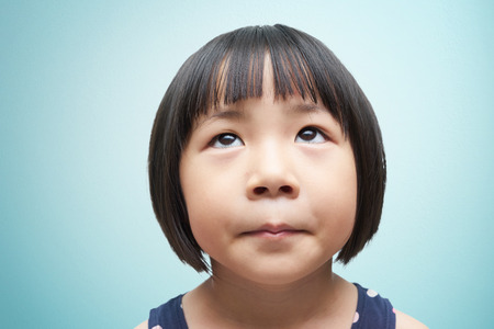 Littel cute girl looking upの写真素材