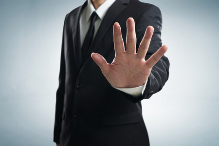 Hand stop shown by businessman.の写真素材