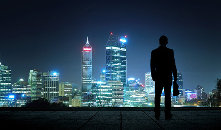 The silhouette portraitof businessman on the roof to see the scenery. Concept of vision of the future .の写真素材