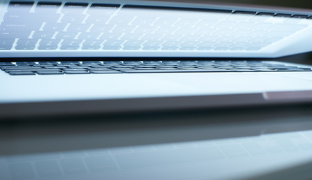 Abstarct closeup angle laptop half close with white screen .seleted focus.の写真素材