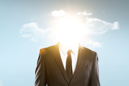 The head of the businessman is covered with sun and clouds, business concept .の写真素材