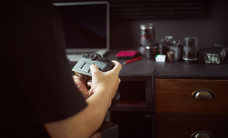 Photographer working checking camera  ,Stylish home studio concept of hipster . Seleted focus.の写真素材