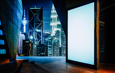 Big empty screen billboard with modern city background .の写真素材