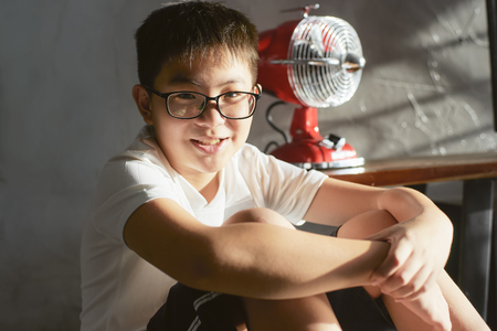 Little asian chinese boy shilly-shally and smile 
 pose .の写真素材