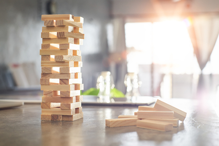 Brown wood building block tower with blur background .Selected focusing .の写真素材