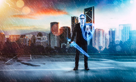 Businessman turned into thunder warrior,holding a lightning sword and shield ,preparation, protection, precaution and security in business concept .の写真素材