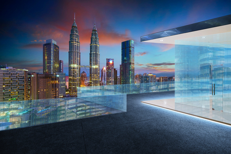 Empty glass balcony with kuala lumpur city skyline , night scene .の写真素材