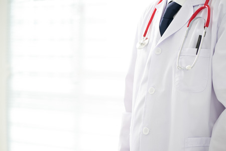 Unknown doctor posing in the office, he is wearing a stethoscope .の写真素材