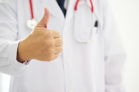 Unknown doctor hands with thumbs up .の写真素材