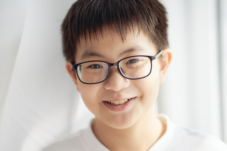 Little asian chinese boy shilly-shally and smile 
 pose .の写真素材