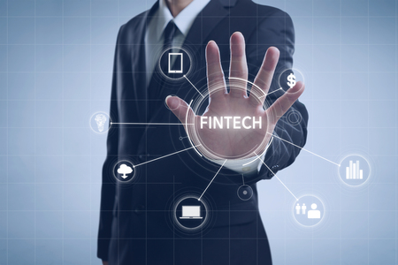 Businessman with fintech icon and internet of things with matrix code background
, Investment and financial internet technology concept.の写真素材