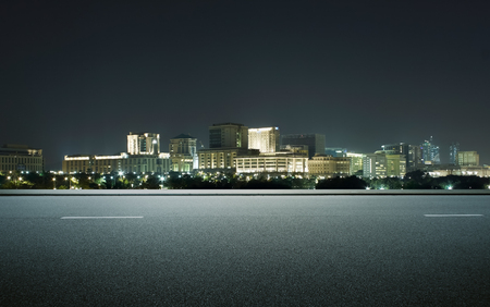Side view asphalt road on snight scene near the modern city .の写真素材