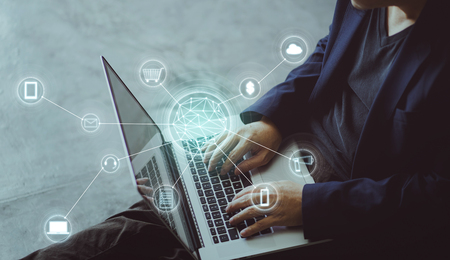 Top angle and closeup view  of businessman using the laptop making online shopping and banking payment. Blurred background .の写真素材