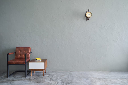 Loft style interior design  with brown armchair and wood side table .の写真素材