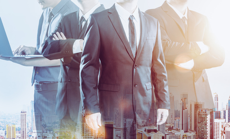 Business partner team standing together , double exposure effect with cityscape  .の写真素材
