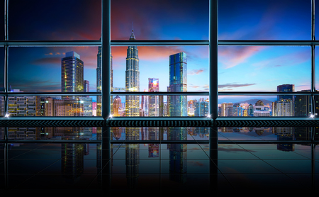 Modern empty and clean office interior with glass windows , Kuala Lumpur city skyline background , early morning scene .の写真素材