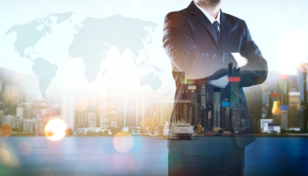 Portrait of businessman .Double exposure effect with Hong Kong city skyline business center view at sunrise .の写真素材
