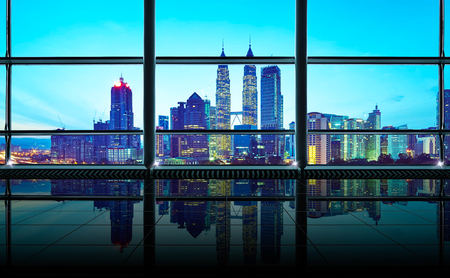 Modern empty and clean office interior with glass windows , Kuala Lumpur city skyline background , early morning scene .の写真素材