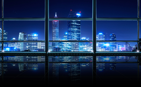 Modern empty and clean office interior with glass windows , Perth city skyline background , night scene .の写真素材