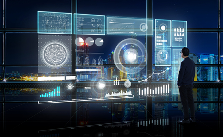 Smart financial analytics working at modern office with big data ,connections icon, internet of things, financial charts and graph virtual screen.の写真素材