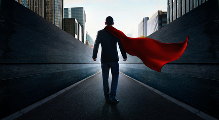 Ambitions concept with hero businessman walking from alley to modern city .の写真素材