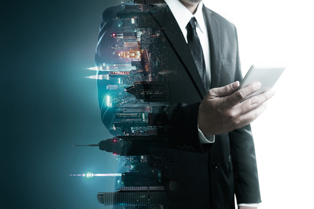 Abstract double exposure image of businessman man using mobile smart phone mix with flip night creative city background . Always stay connected concept .の写真素材