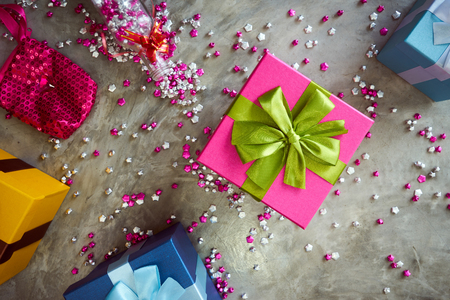 Colorful gift box with little star craft , cement texture desktop top view . Present gifts ,Christmas ,New year seasonal holiday give concept .の写真素材