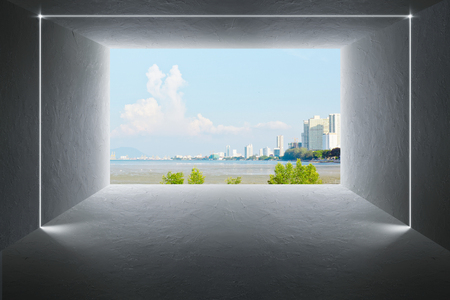 Empty space cement wall and floor with beautiful outdoor landscape open window design .の写真素材