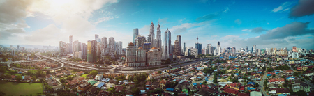 Panorama cityscape view in the middle of Kuala Lumpur city center , early morning with little mist , Malaysia .