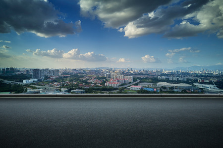 Panoramic view of asphalt road side with beautiful Kuala Lumpur city skyline.の写真素材