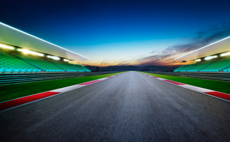 View of the infinity empty asphalt international race track .Night scene .の写真素材