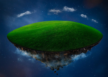 Fantasy island floating in the air with green field . Night scene .の写真素材