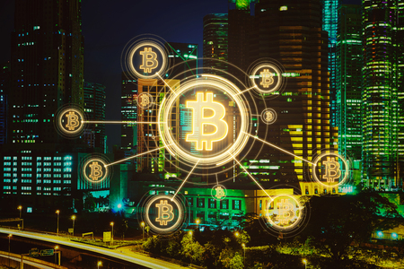 Bitcoins and blockchain network connection with night city background .Electronic money ,blockchain transfers and finance concept.の写真素材