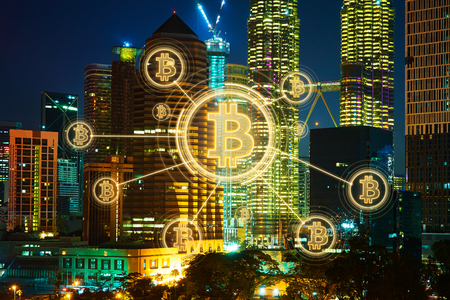 Bitcoins and blockchain network connection with night city background .Electronic money ,blockchain transfers and finance concept.の写真素材