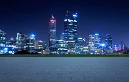 Empty square ground floor with city skyline background  . Night scene .の写真素材