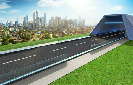 Empty asphalt road with tunnel ,greenfield and modern city skyline background . Mixed media .の写真素材