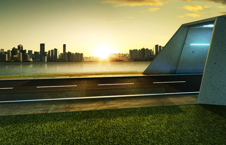 Empty asphalt road with tunnel ,greenfield and modern city skyline background . Mixed media .の写真素材