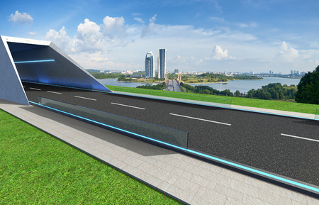 Empty asphalt road with tunnel ,greenfield and modern city skyline background . Mixed media .の写真素材