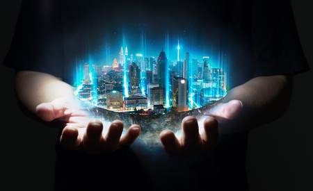 Unknown hand holding fantasy island floating in the air with network light came out from the ground , Smart city and wireless network connection concept .の写真素材