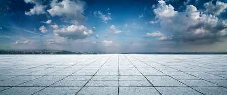 Panorama big field view of empty square marble floor with dramatic sky .の写真素材