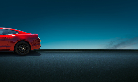 Sport car parked on road side with night sky background .の写真素材