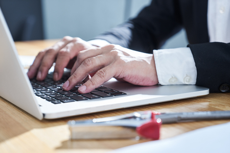 Closeup businessman using laptop to work .の写真素材