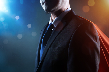 Closeup Businessman in suit and cape hero . bokeh and light flare effect apply .の写真素材