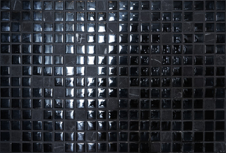 Black stone and shiny mosaic wall backgroundの写真素材
