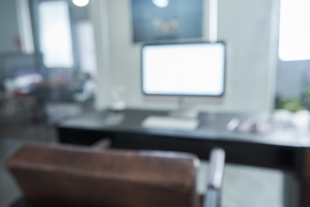 Blurred and defocused office workplace background , for commercial business ads using background .の写真素材