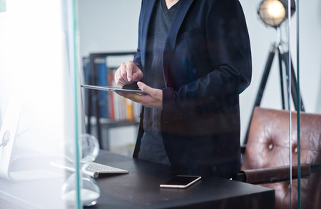 Businessman using digital tablet to workの写真素材