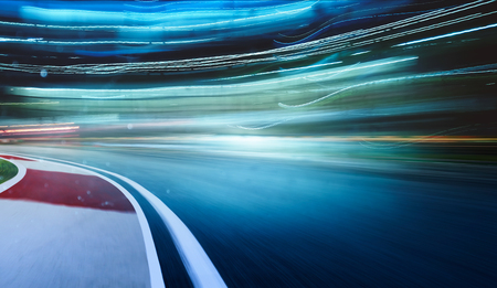 Curvy racing track with motion blur and lighting effect apply .の写真素材