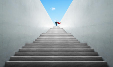 Successful hero businessman climbing on stair , ambitions concept .の写真素材